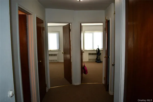 a view of a bathroom from a hallway