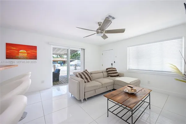 a living room with furniture and a window