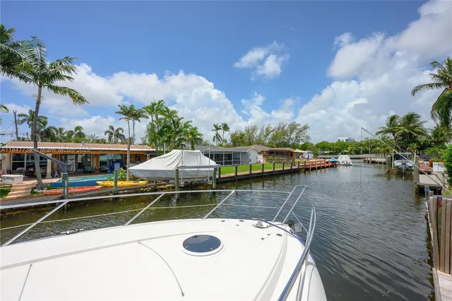 a view of a lake with chairs