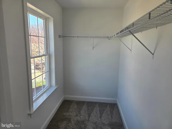 a view of empty room with windows