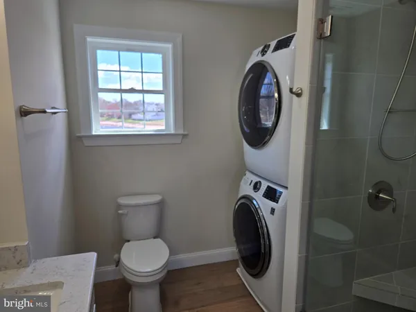 a bathroom with a toilet and a sink