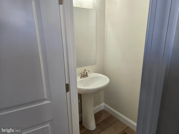 a bathroom with a sink and mirror