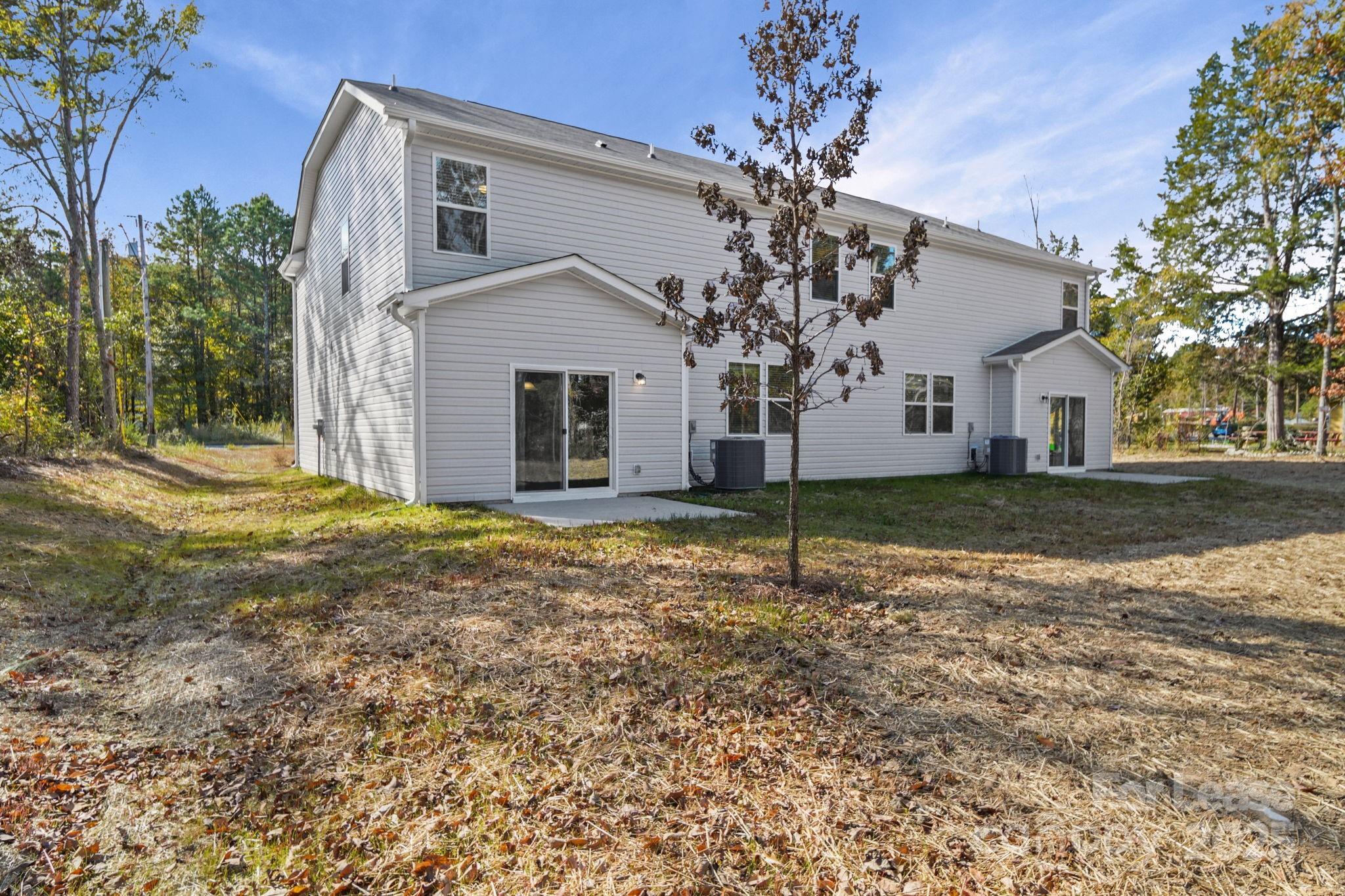 3200 Polk And White Road, Unit A Charlotte, NC 28269 - Photo 17 of 35 a view of a house with a yard