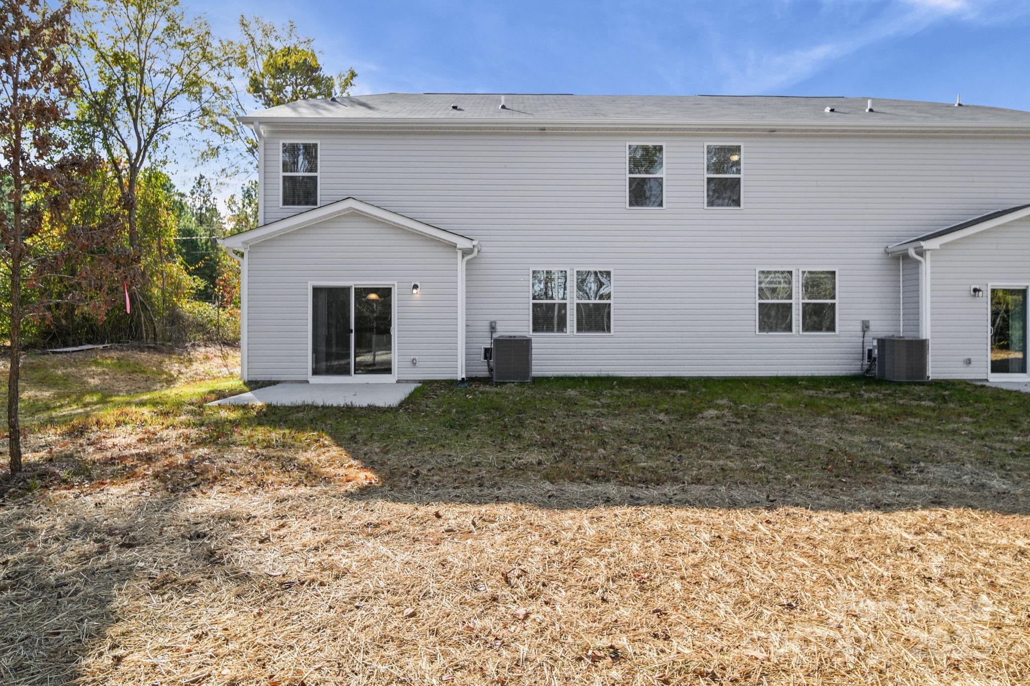 3200 Polk And White Road, Unit A Charlotte, NC 28269 - Photo 18 of 35 a view of a house with a yard