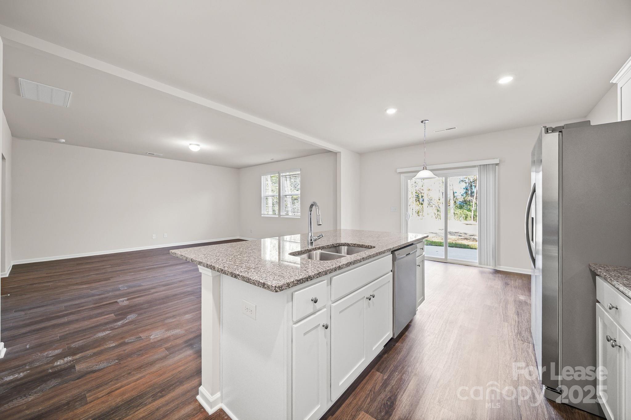 3200 Polk And White Road, Unit A Charlotte, NC 28269 - Photo 28 of 35 a large kitchen with granite countertop a large counter top and sink