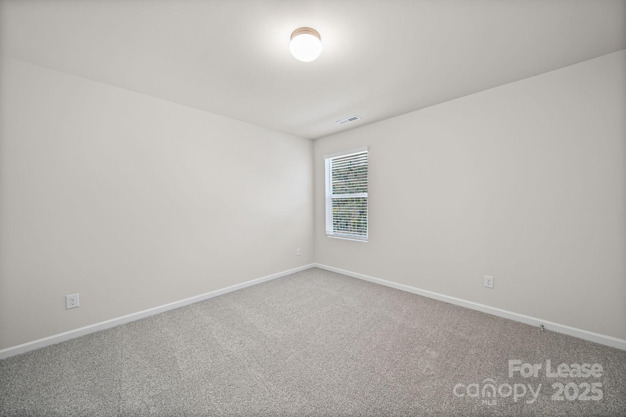 3200 Polk And White Road, Unit A Charlotte, NC 28269 - Photo 33 of 35 an empty room with windows
