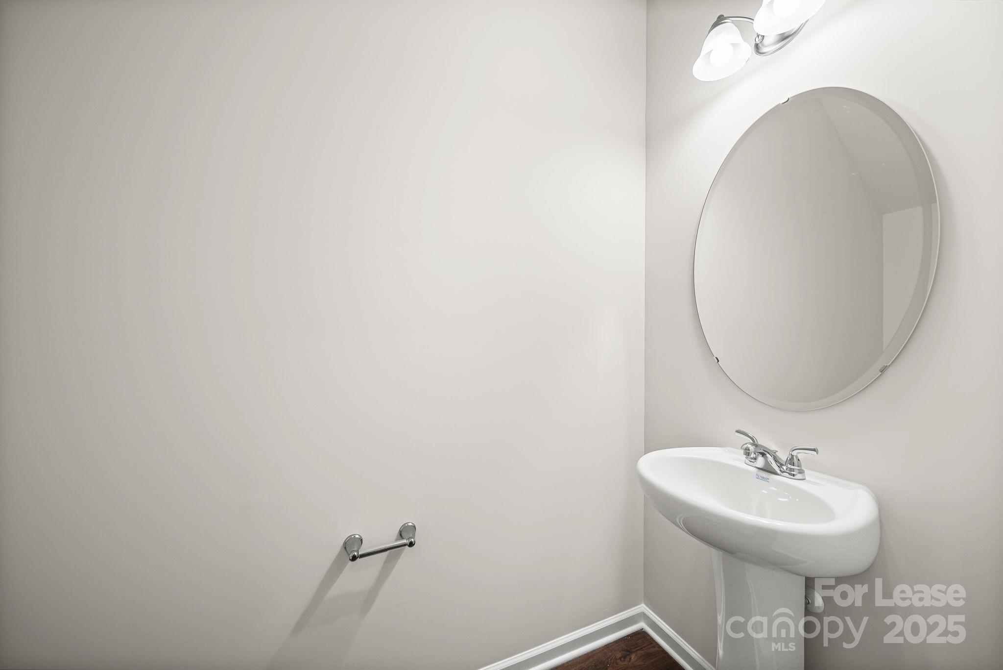 3200 Polk And White Road, Unit A Charlotte, NC 28269 - Photo 4 of 35 a bathroom with a sink and a mirror
