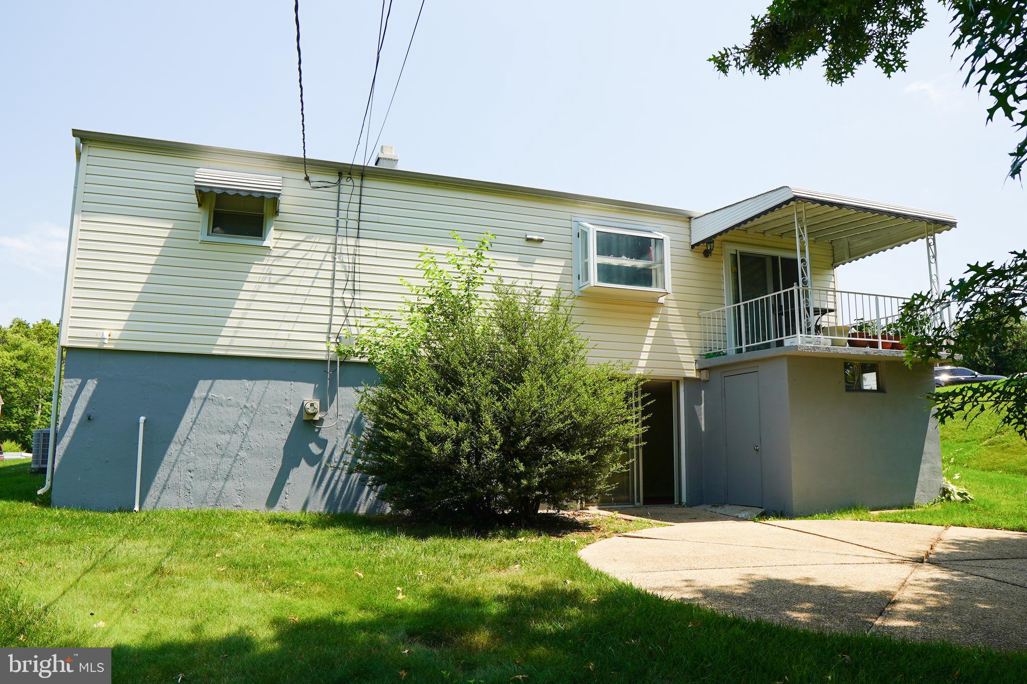 1512 Customs Road Baltimore, MD 21237 - Photo 39 of 43 a view of a house with a backyard