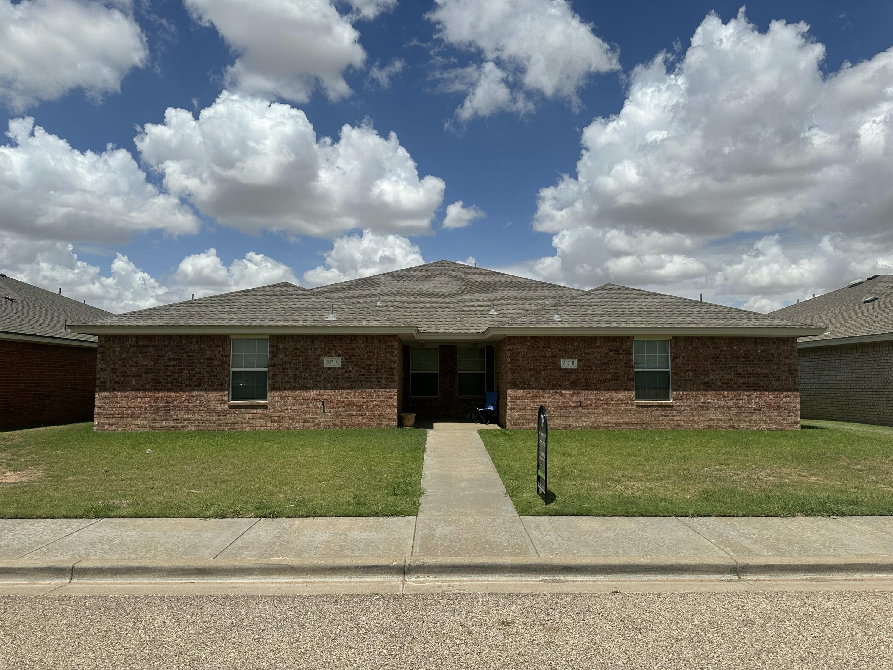 507 North Clinton Avenue Lubbock, TX 79416 - Photo 1 of 10 a view of a house with a yard and a garage