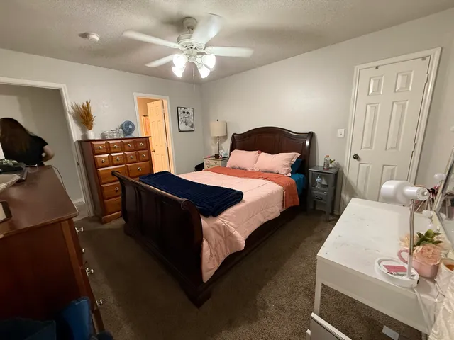 a bed room with a bed and a tv