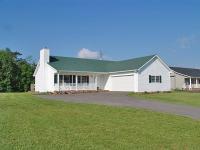 9917 Goodview Road Goodview, VA 24095 - Photo 1 of 1 a front view of a house with a yard