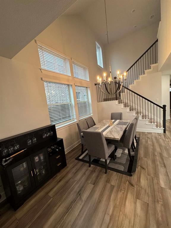 8628 Spindletop Drive Fort Worth, TX 76120 - Photo 12 of 21 a view of a dining room with furniture and wooden floor