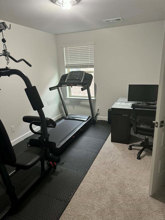 8628 Spindletop Drive Fort Worth, TX 76120 - Photo 14 of 21 a bedroom with a workspace