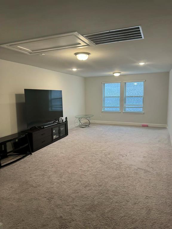 8628 Spindletop Drive Fort Worth, TX 76120 - Photo 17 of 21 a room with a flat screen tv and a window