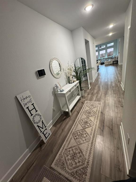 8628 Spindletop Drive Fort Worth, TX 76120 - Photo 3 of 21 an entryway with wooden floor