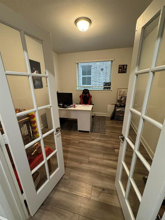 8628 Spindletop Drive Fort Worth, TX 76120 - Photo 4 of 21 a living room with furniture and a window