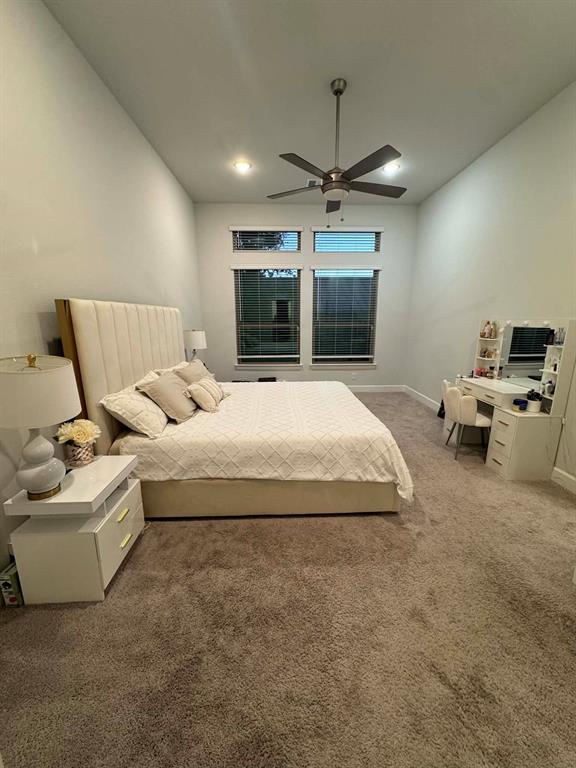 8628 Spindletop Drive Fort Worth, TX 76120 - Photo 7 of 21 a spacious bedroom with a bed and furniture