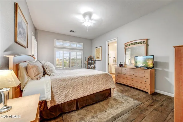 a bathroom with a tub a sink and mirror