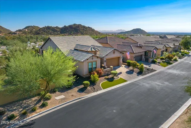 an aerial view of a house with a garden