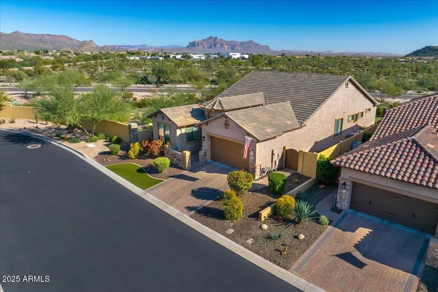 an aerial view of multiple houses on a city street