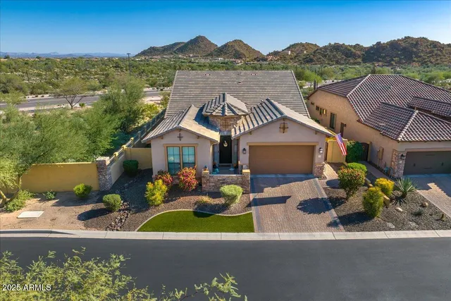 an aerial view of a house with a garden