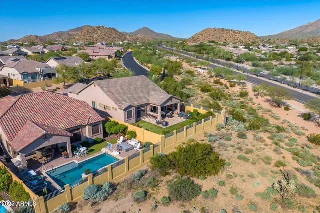 a view of a swimming pool with an outdoor seating