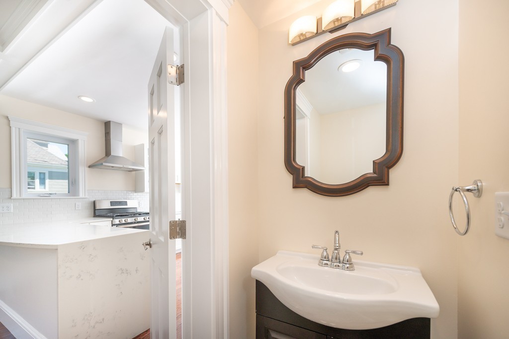 180 Magazine Street, Unit 2 Cambridge, MA 02139 - Photo 12 of 20 a bathroom with a sink and a mirror
