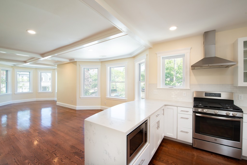 180 Magazine Street, Unit 2 Cambridge, MA 02139 - Photo 2 of 20 a kitchen with a stove and a white cabinets