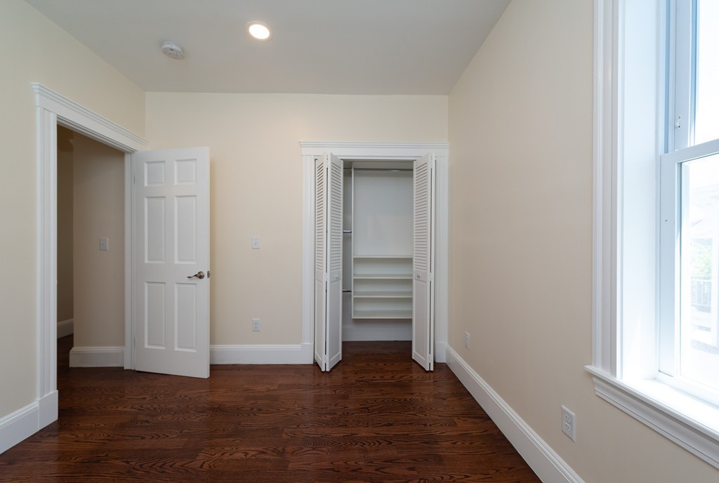 180 Magazine Street, Unit 2 Cambridge, MA 02139 - Photo 10 of 20 wooden floor in an empty room