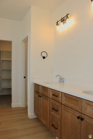 2613 Scarlet Road, Unit 258 Eagle Mountain, UT 84005 - Photo 16 of 32 Double vanity with light wood-finish cabinetry and matte black hardware