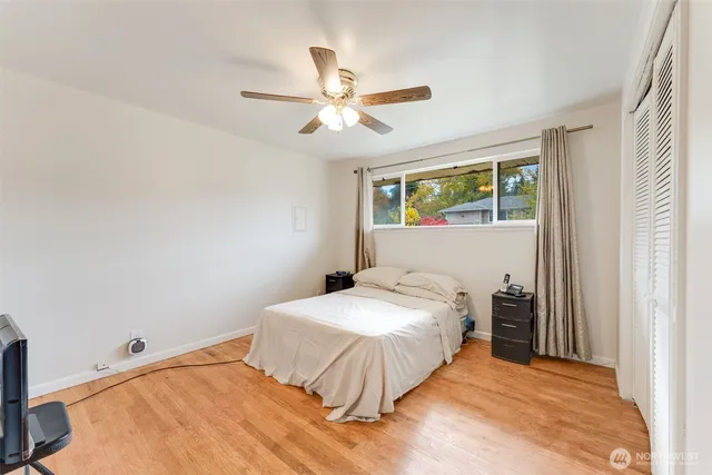 a bedroom with a bed and window