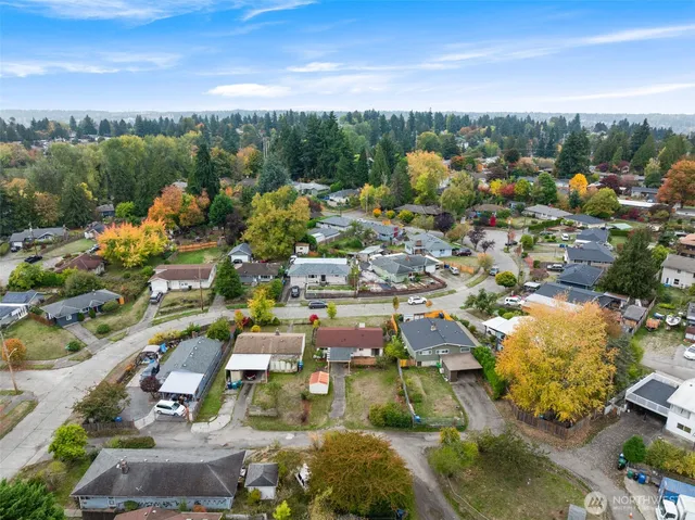 an aerial view of residential houses with outdoor space