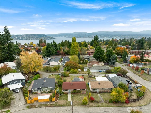 an aerial view of residential houses with outdoor space