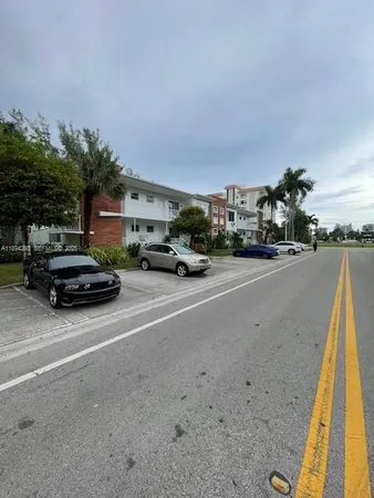 a view of street with parked cars