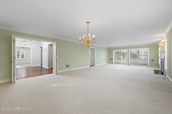 a view of empty room with a fireplace