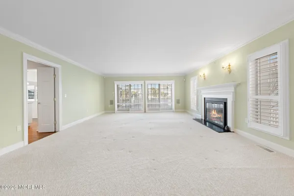 a large kitchen with stainless steel appliances kitchen island granite countertop a sink and cabinets