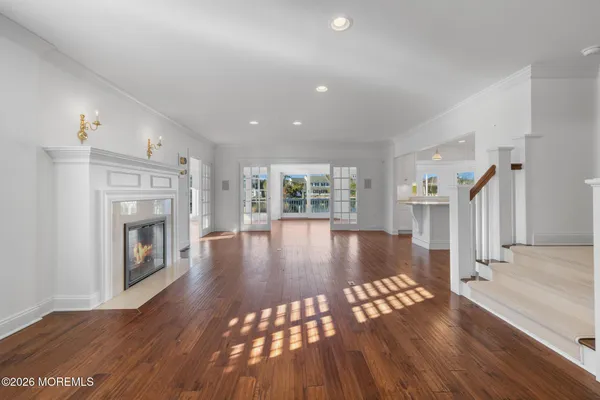 a view of an entryway with wooden floor and windows