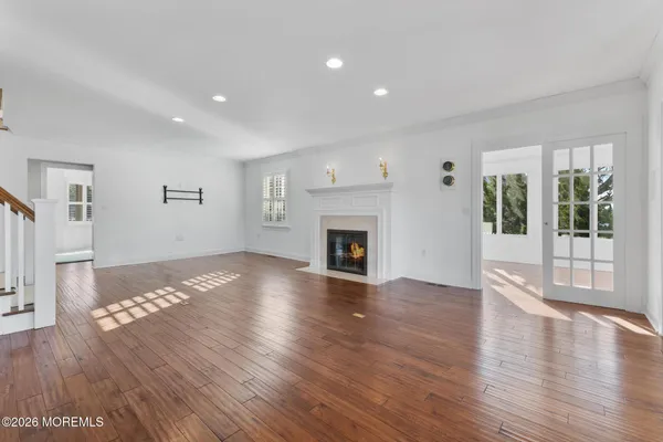 a view of an entryway with wooden floor