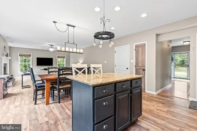 an open kitchen with a table and chairs in it