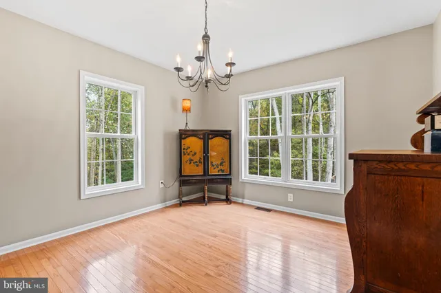 a view of a livingroom with a window and furniture