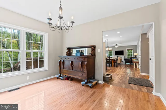 a view of a livingroom with furniture and a large window