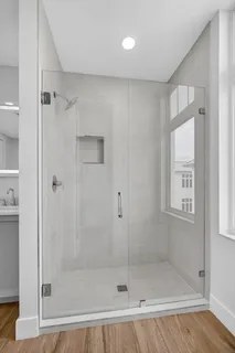 a view of an empty room and wooden floor