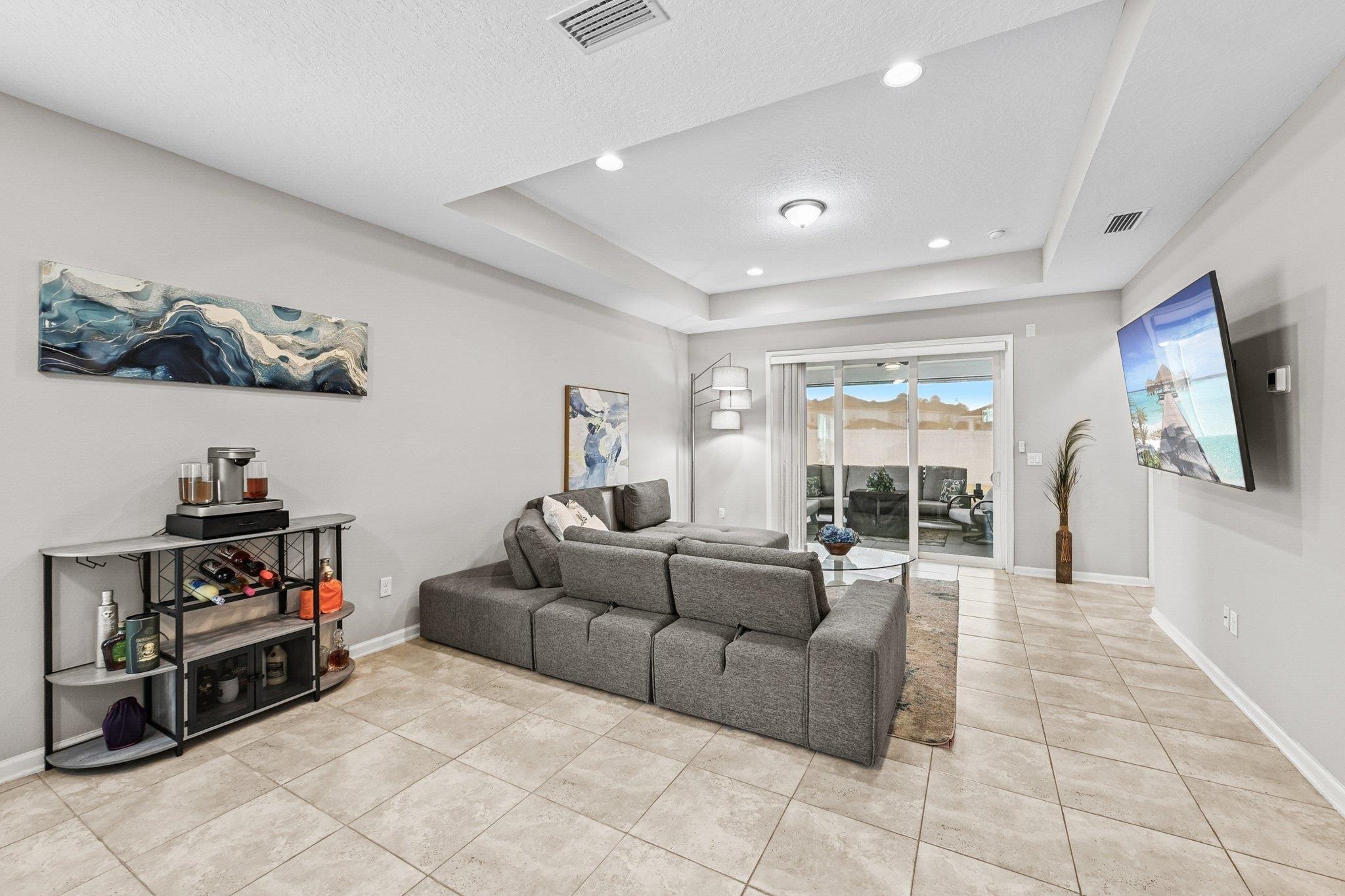 75 Pinzon Place St. Augustine, FL 32095 - Photo 12 of 51 a living room with furniture and a flat screen tv
