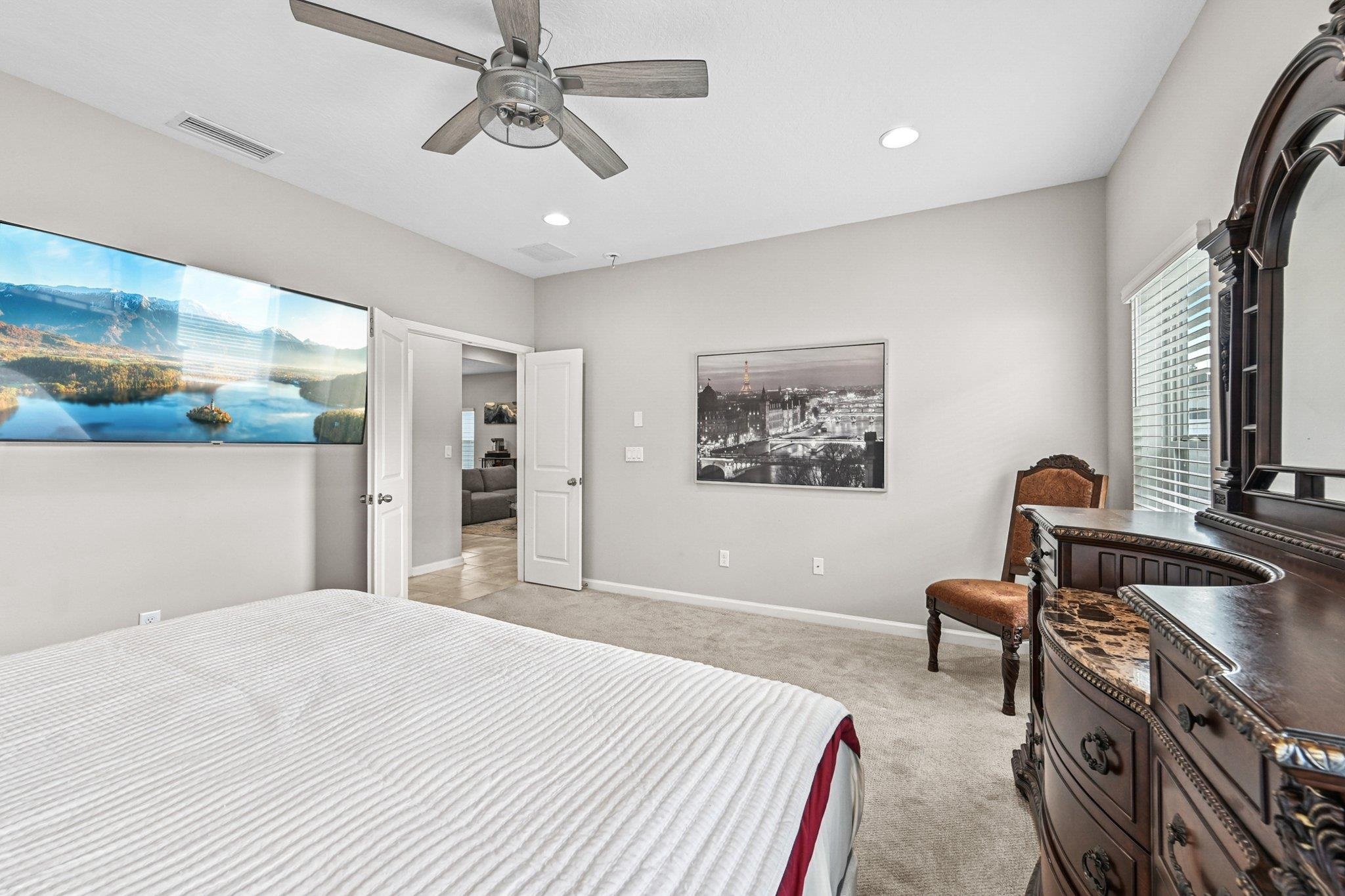 75 Pinzon Place St. Augustine, FL 32095 - Photo 17 of 51 a bedroom with a bed and a chandelier