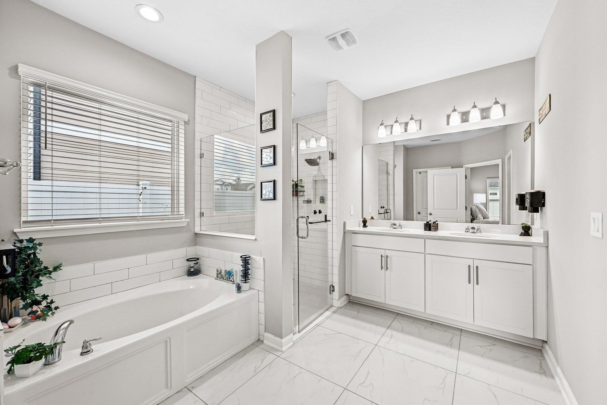 75 Pinzon Place St. Augustine, FL 32095 - Photo 18 of 51 a bathroom with a tub sink and mirror