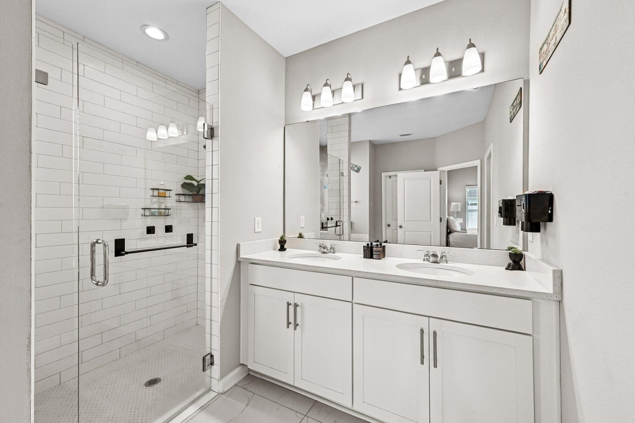 75 Pinzon Place St. Augustine, FL 32095 - Photo 19 of 51 a bathroom with a double vanity sink mirror and shower