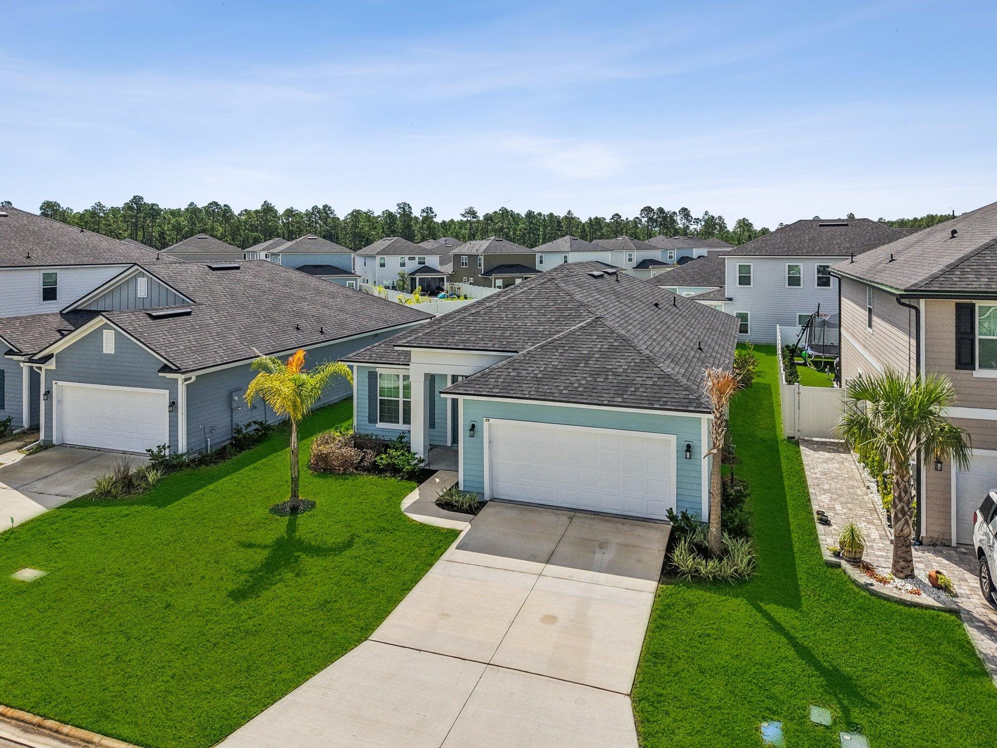 75 Pinzon Place St. Augustine, FL 32095 - Photo 26 of 51 a front view of a house with a yard and a garage