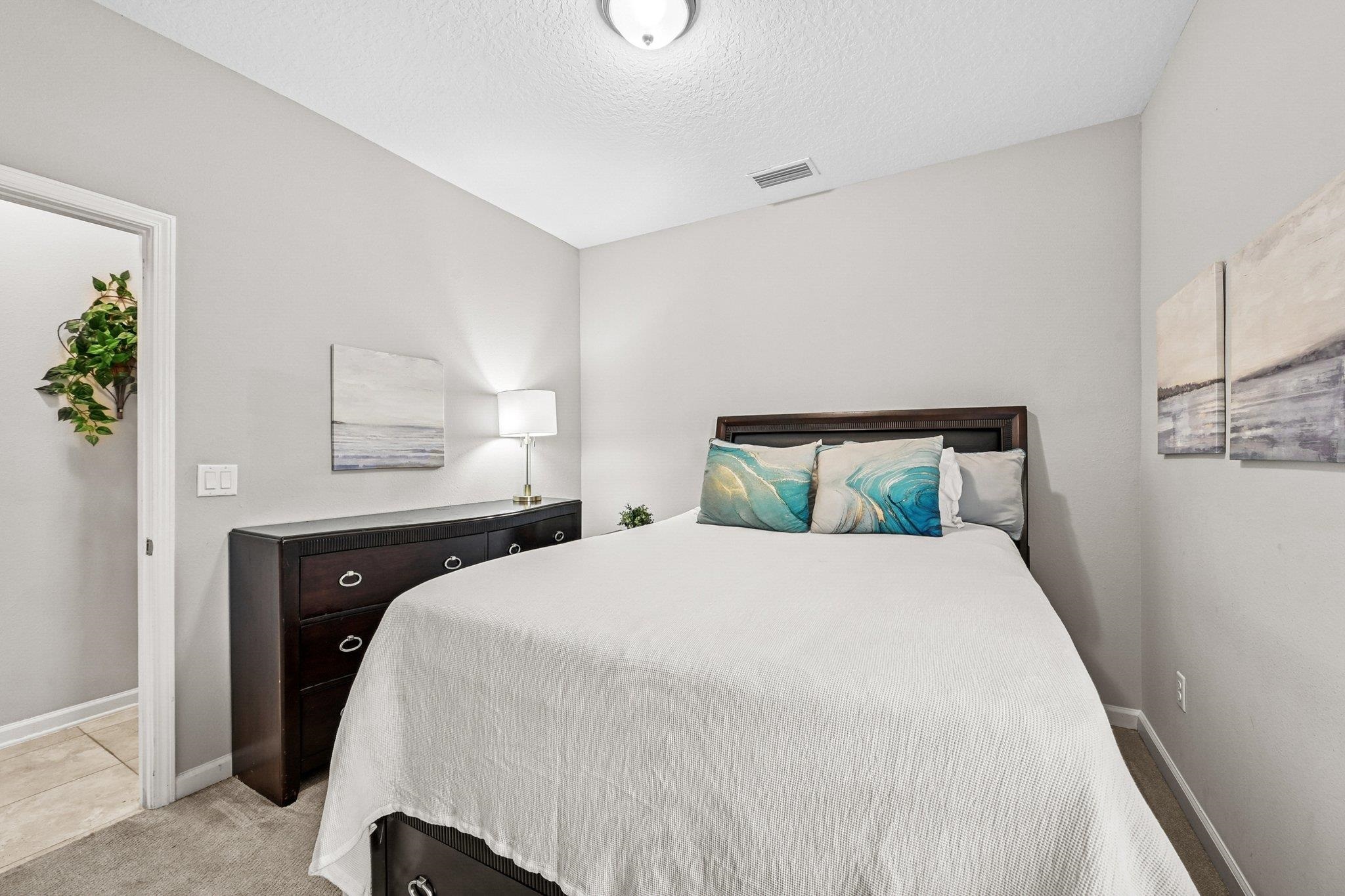 75 Pinzon Place St. Augustine, FL 32095 - Photo 31 of 51 a bedroom with a bed and wooden floor