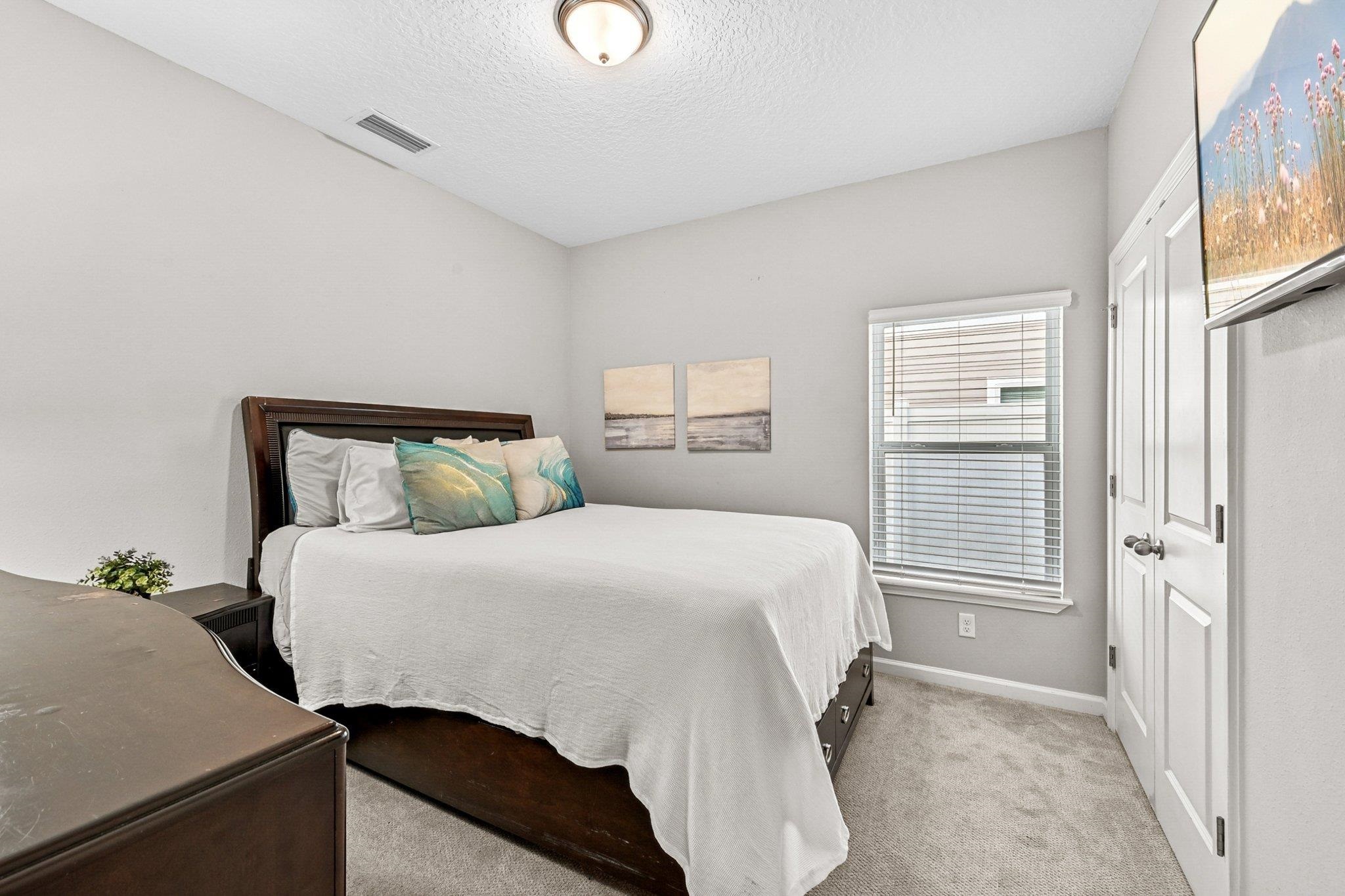 75 Pinzon Place St. Augustine, FL 32095 - Photo 32 of 51 a bedroom with a bed and a window