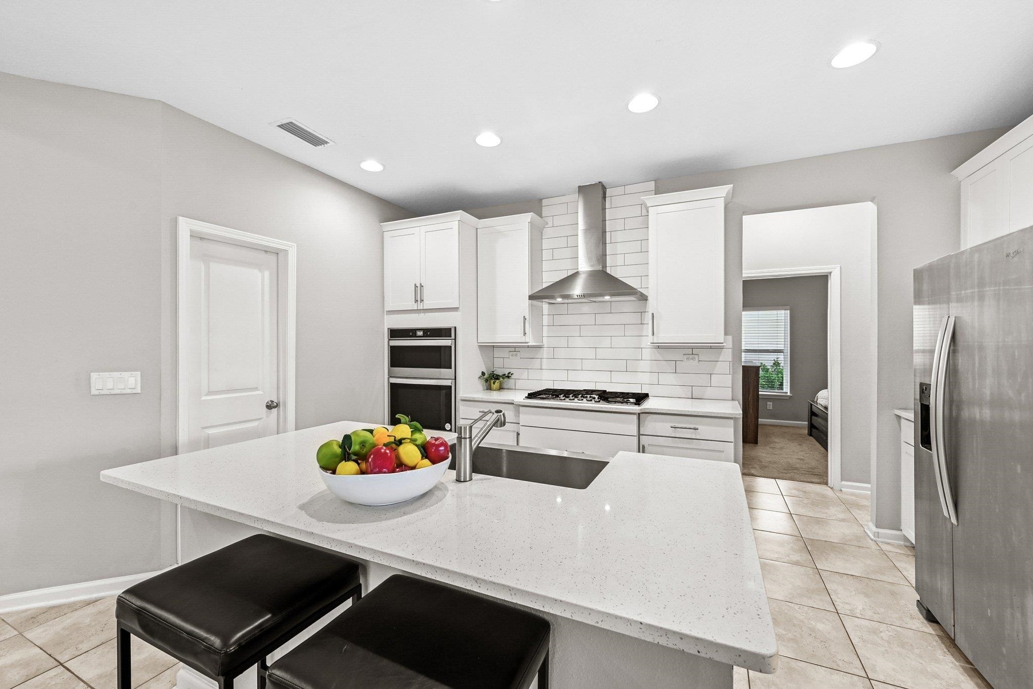 75 Pinzon Place St. Augustine, FL 32095 - Photo 6 of 51 a kitchen with stainless steel appliances a stove refrigerator sink and cabinets